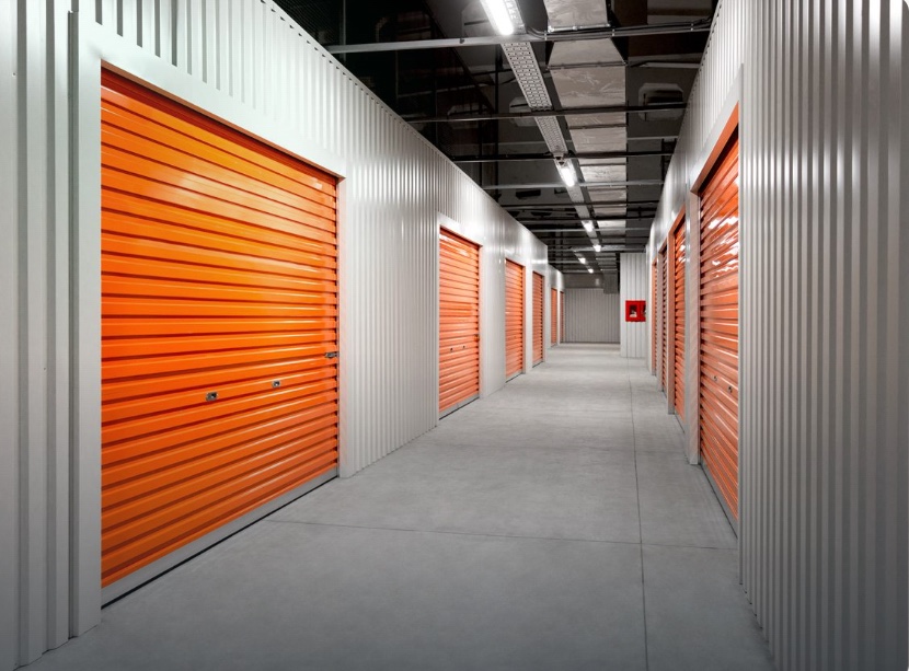 Self-storage corridor with monitored roller-door units